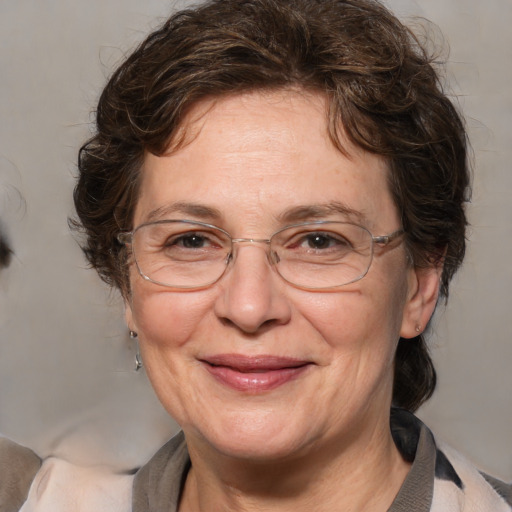 Joyful white middle-aged female with medium  brown hair and brown eyes