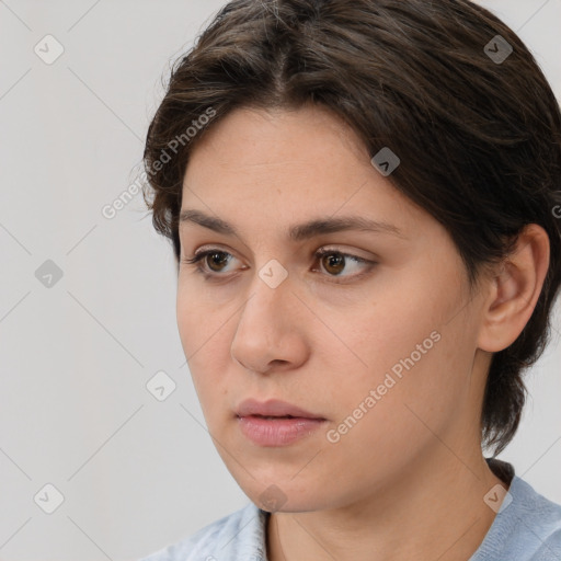 Neutral white young-adult female with medium  brown hair and brown eyes