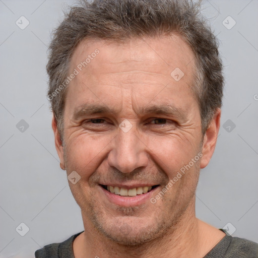 Joyful white middle-aged male with short  brown hair and brown eyes