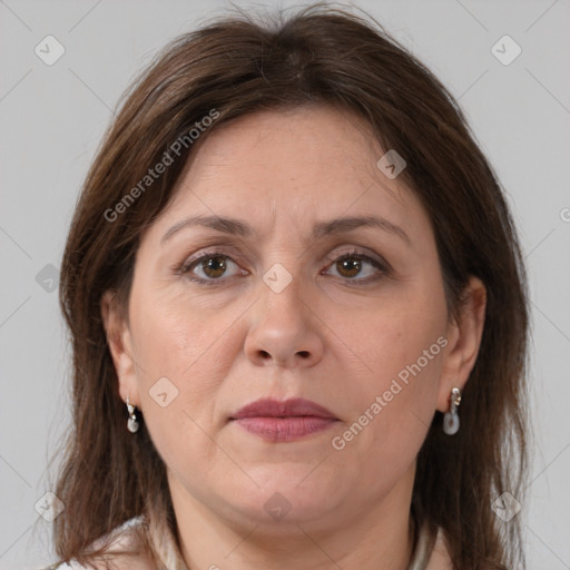 Joyful white adult female with medium  brown hair and grey eyes