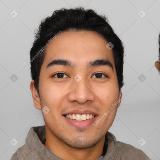 Joyful latino young-adult male with short  black hair and brown eyes