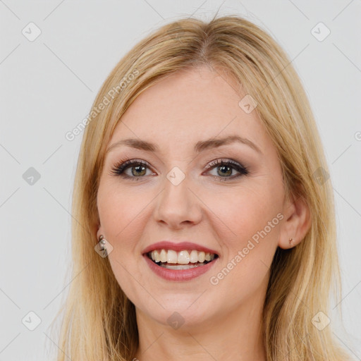 Joyful white young-adult female with long  brown hair and brown eyes