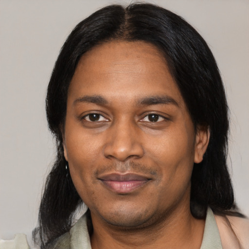 Joyful black adult male with medium  black hair and brown eyes