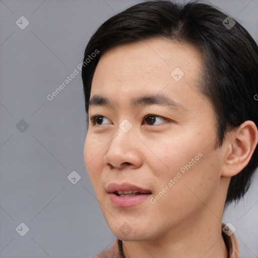 Joyful asian young-adult male with short  black hair and brown eyes
