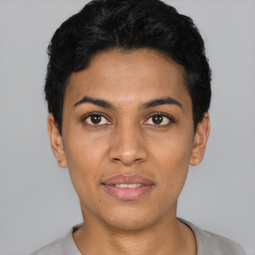 Joyful latino young-adult female with short  black hair and brown eyes