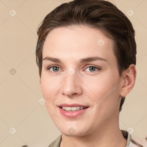 Joyful white young-adult female with short  brown hair and grey eyes