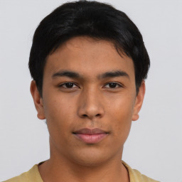 Neutral asian young-adult male with short  brown hair and brown eyes