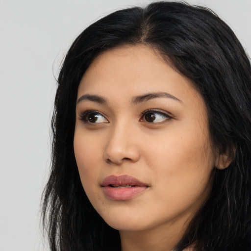 Neutral latino young-adult female with long  black hair and brown eyes