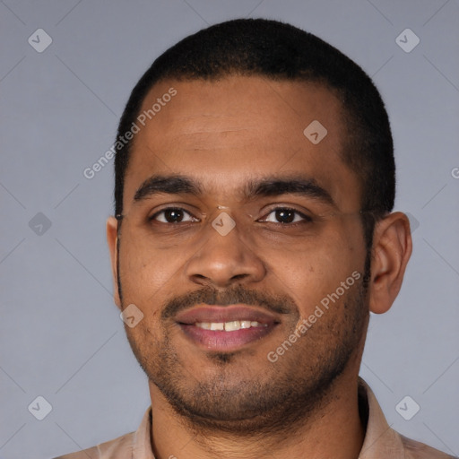 Joyful latino young-adult male with short  brown hair and brown eyes