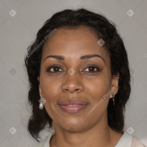 Joyful black adult female with medium  brown hair and brown eyes