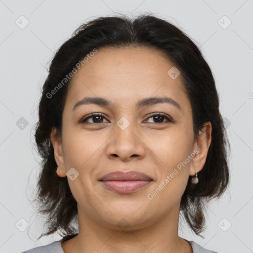 Joyful latino young-adult female with medium  brown hair and brown eyes