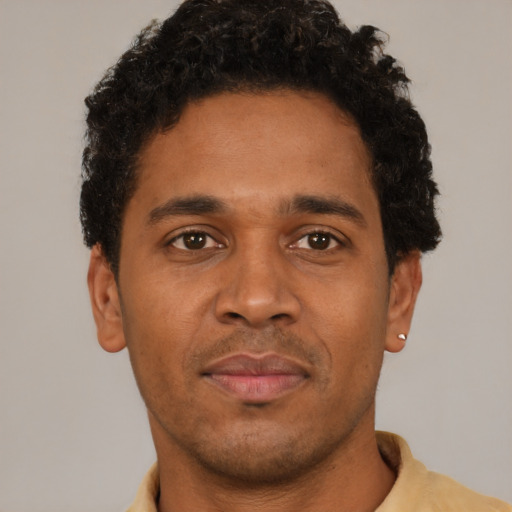 Neutral latino young-adult male with short  brown hair and brown eyes