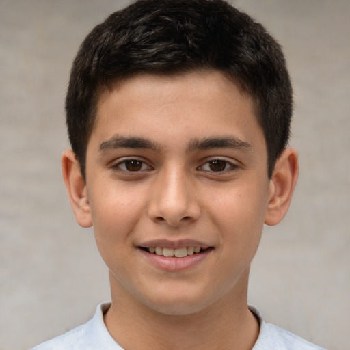 Joyful white child male with short  brown hair and brown eyes