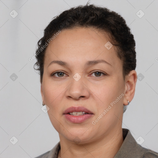 Joyful white adult female with short  brown hair and brown eyes