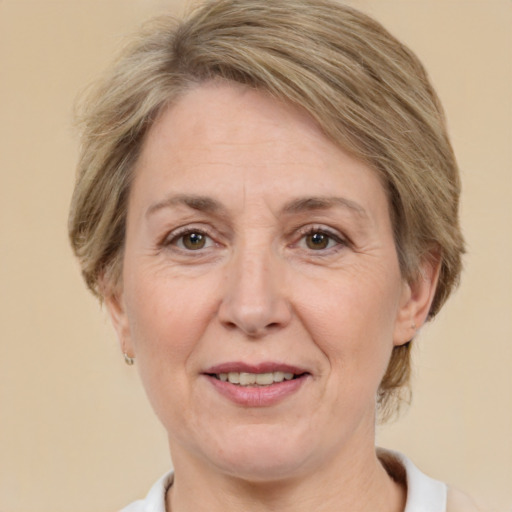 Joyful white adult female with medium  brown hair and green eyes