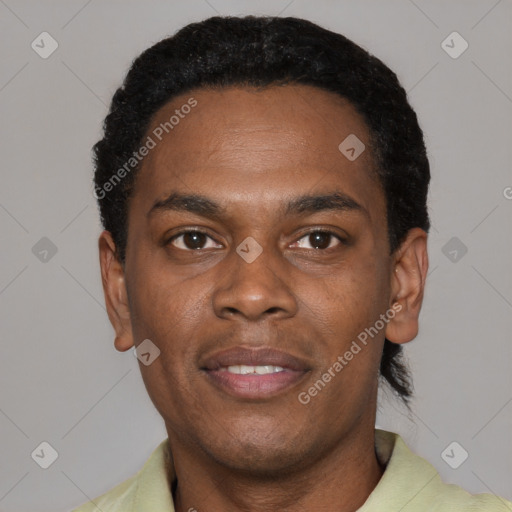 Joyful black young-adult male with short  black hair and brown eyes