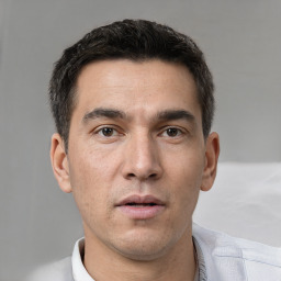 Neutral white young-adult male with short  black hair and brown eyes