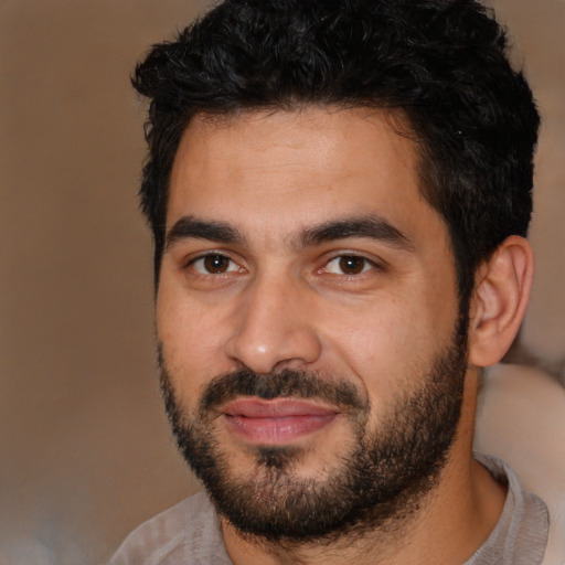 Joyful latino young-adult male with short  black hair and brown eyes