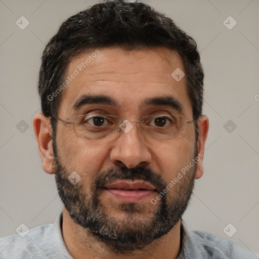 Joyful white adult male with short  black hair and brown eyes