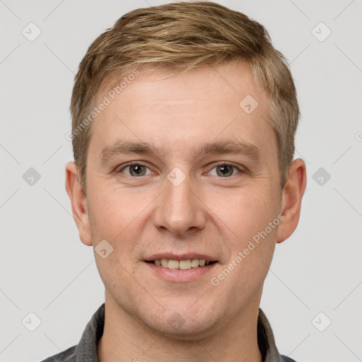 Joyful white adult male with short  brown hair and grey eyes