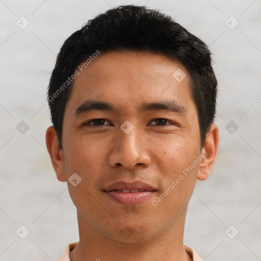 Joyful asian young-adult male with short  black hair and brown eyes