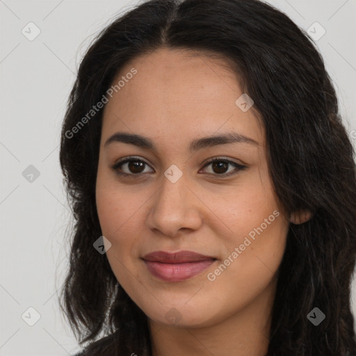 Joyful latino young-adult female with long  brown hair and brown eyes