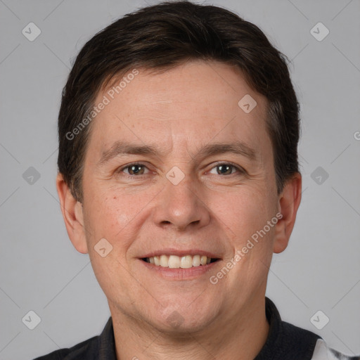 Joyful white adult male with short  brown hair and brown eyes