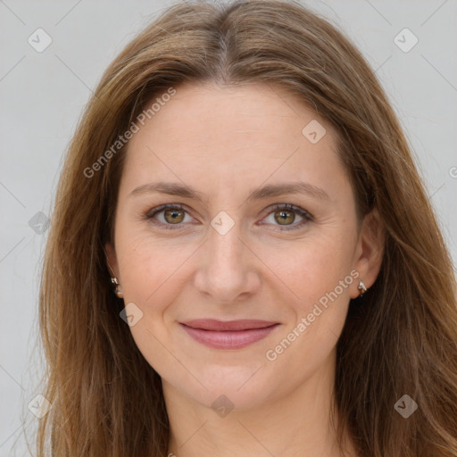 Joyful white young-adult female with long  brown hair and green eyes