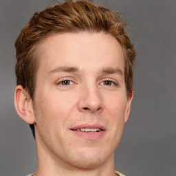 Joyful white adult male with short  brown hair and grey eyes