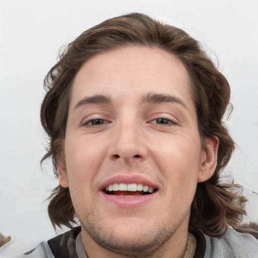 Joyful white young-adult male with medium  brown hair and brown eyes