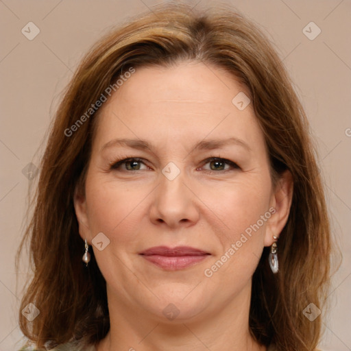 Joyful white adult female with medium  brown hair and grey eyes