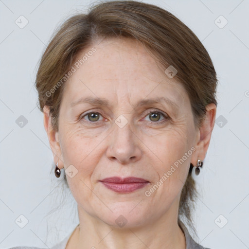 Joyful white adult female with medium  brown hair and grey eyes