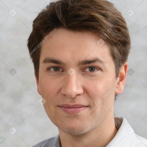 Joyful white adult male with short  brown hair and grey eyes