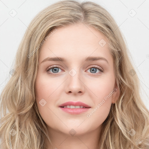 Joyful white young-adult female with long  brown hair and blue eyes