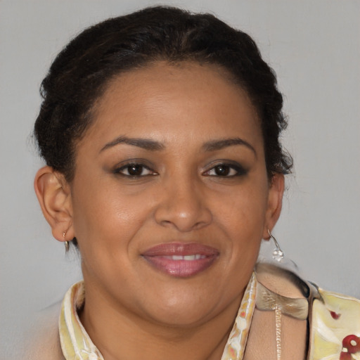 Joyful latino adult female with short  brown hair and brown eyes