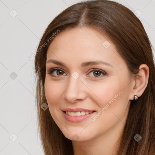 Joyful white young-adult female with long  brown hair and brown eyes