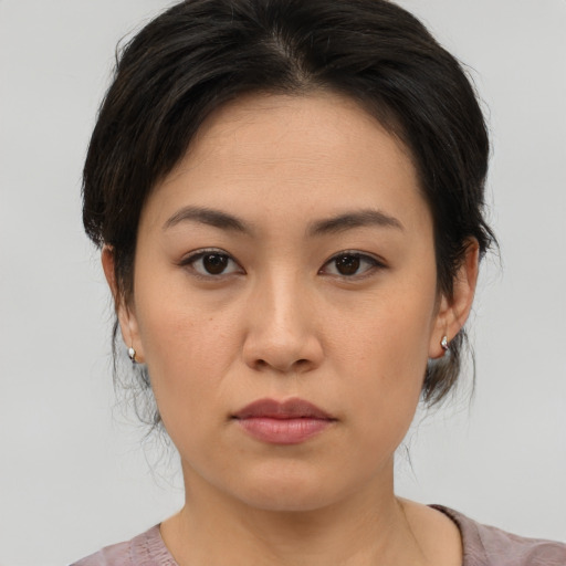 Neutral asian young-adult female with medium  brown hair and brown eyes