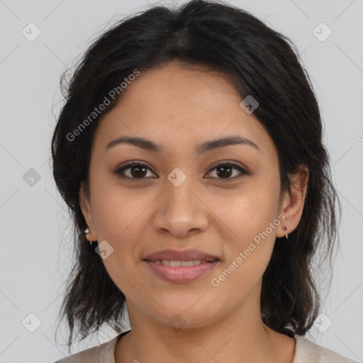 Joyful latino young-adult female with medium  brown hair and brown eyes