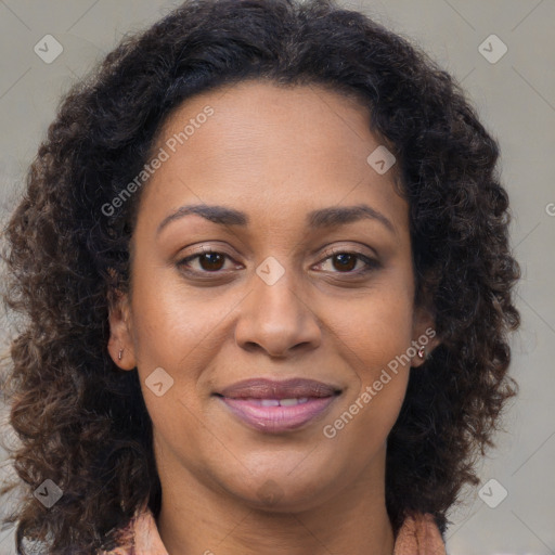 Joyful latino adult female with long  brown hair and brown eyes