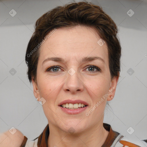 Joyful white adult female with short  brown hair and grey eyes