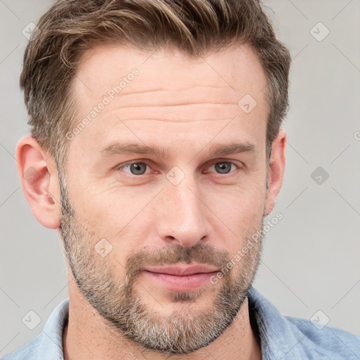 Joyful white adult male with short  brown hair and grey eyes