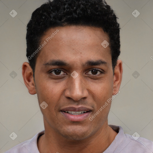 Joyful black young-adult male with short  black hair and brown eyes