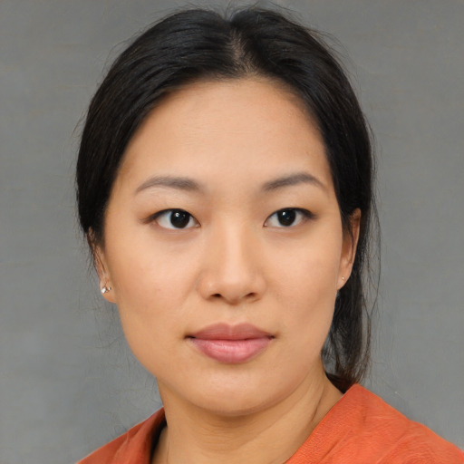Neutral asian young-adult female with medium  black hair and brown eyes
