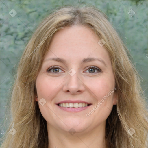 Joyful white young-adult female with long  brown hair and green eyes