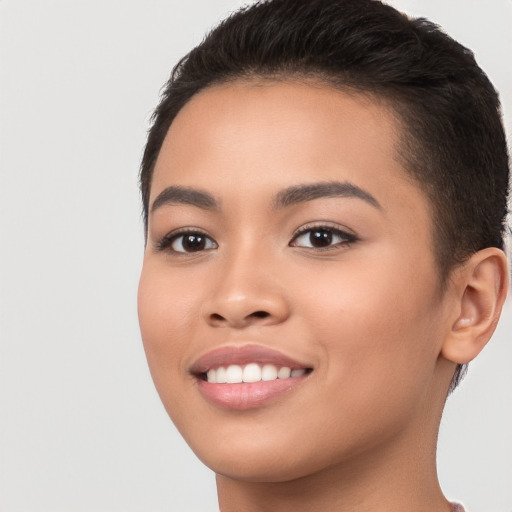 Joyful white young-adult female with short  brown hair and brown eyes