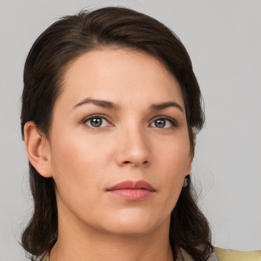 Neutral white young-adult female with medium  brown hair and brown eyes