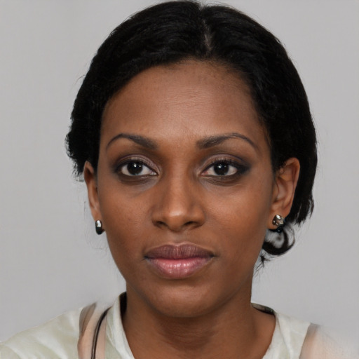Neutral black young-adult female with medium  black hair and brown eyes