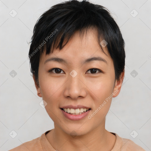 Joyful asian young-adult female with short  black hair and brown eyes