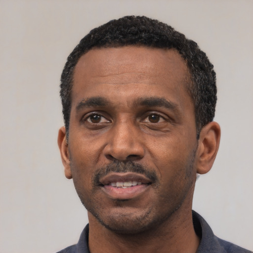 Neutral latino adult male with short  black hair and brown eyes