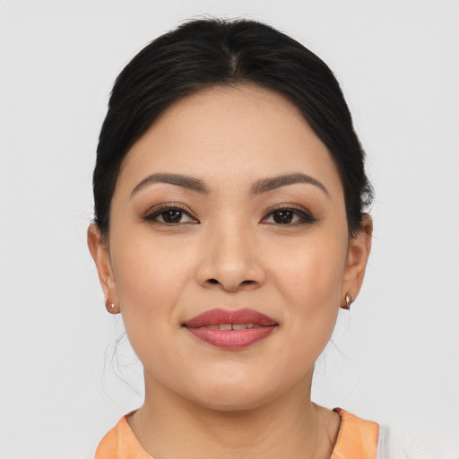 Joyful asian young-adult female with medium  black hair and brown eyes